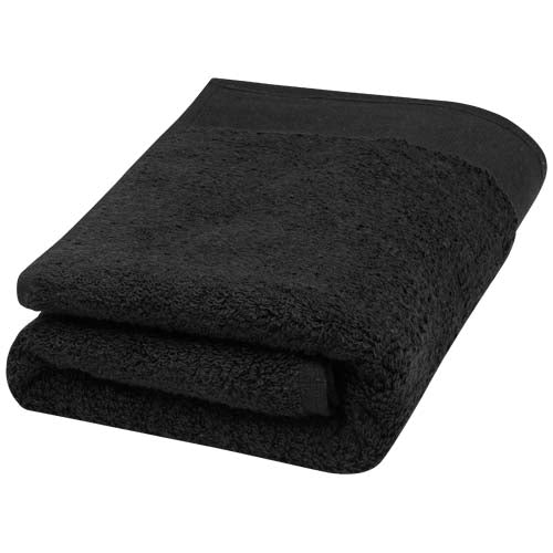 Schwarzes Nora 550 g/m² Baumwollhandtuch 50x100 cm, individuell bedruckbar, nachhaltig, bei Signalshop.de.