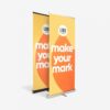 Zwei vertikale Banner mit dem Text „Make Your Mark“ und einem Logo-Platzhalter auf einem gelb-orangefarbenen Hintergrund.