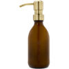 Braune Glasflasche mit goldenem Pumpspender, aufgedruckt „Healthfit“.